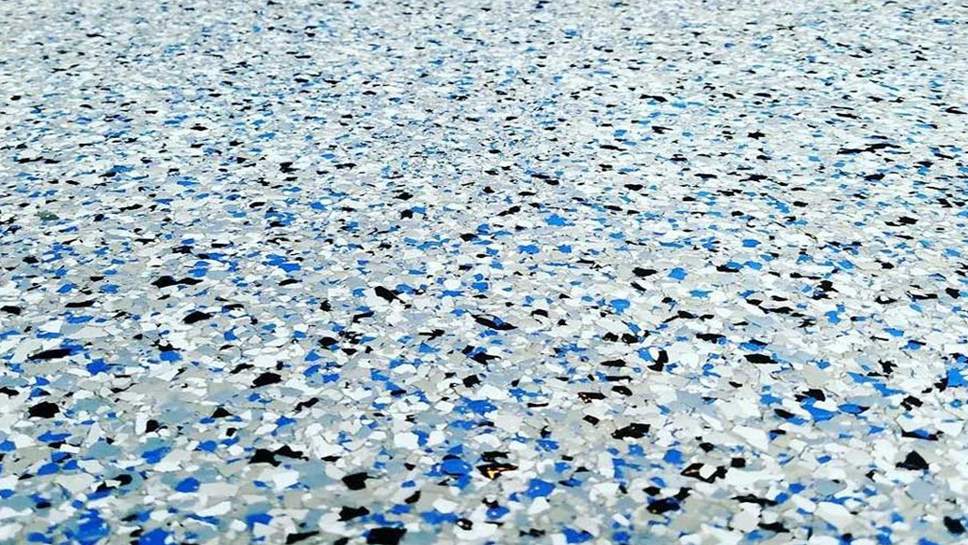 Resin Flake Flooring - Decorative resin floors with a flake finish for added grip, texture, and visual appeal in any space.